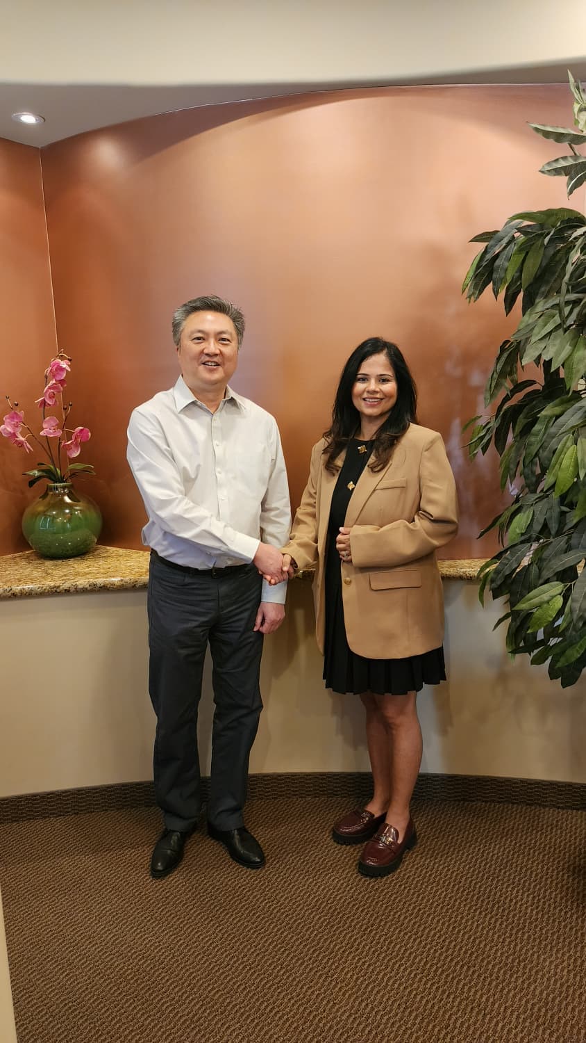 Dr. James Wei shaking hands with Dr. Shriya Sarin inside Promenade Dental